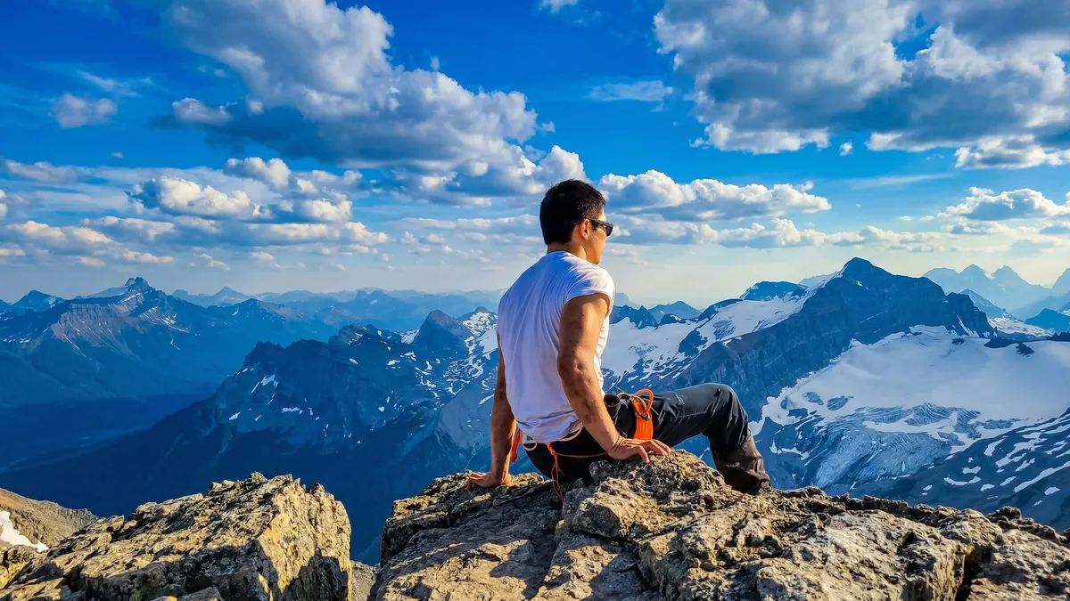 Bo Li at a mountain summit overlooking the Canadian Rockies